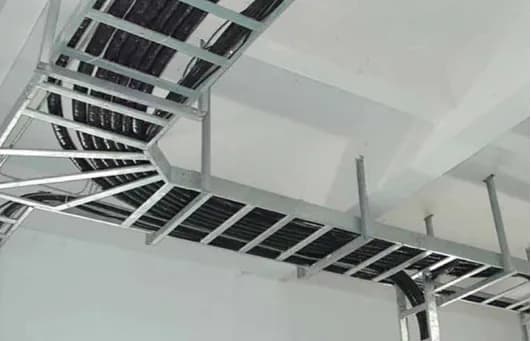 Cable trays installed under a factory ceiling